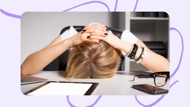 a woman stressed at her desk