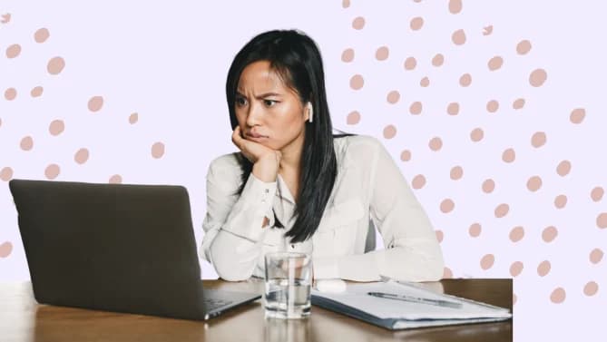woman looking distressed at work