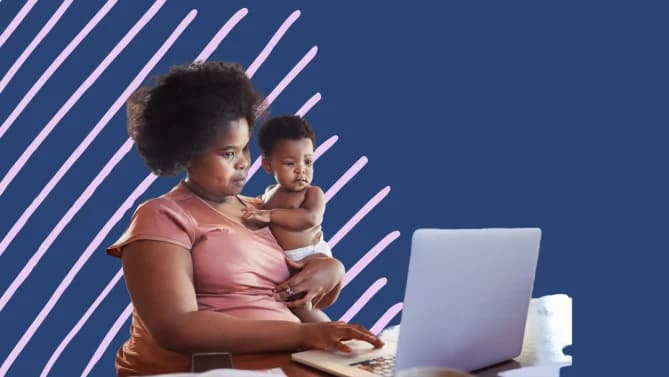 a woman looking at her laptop and holding a baby