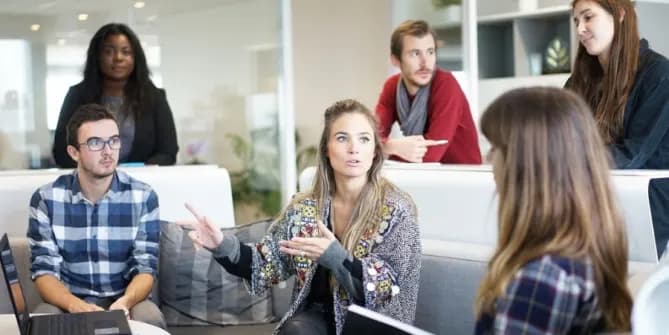 Woman speaking at company meeting