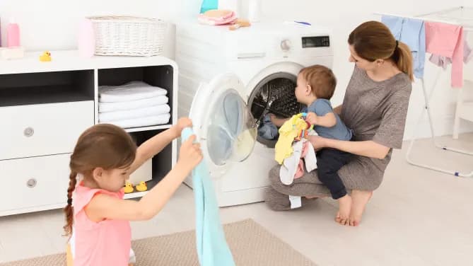 mother and children doing laundry together