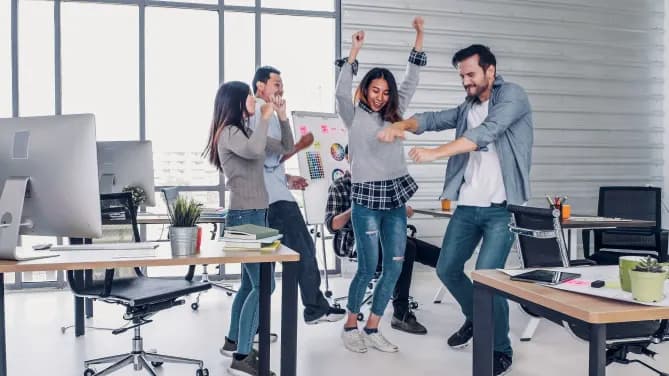 employees dancing in the office