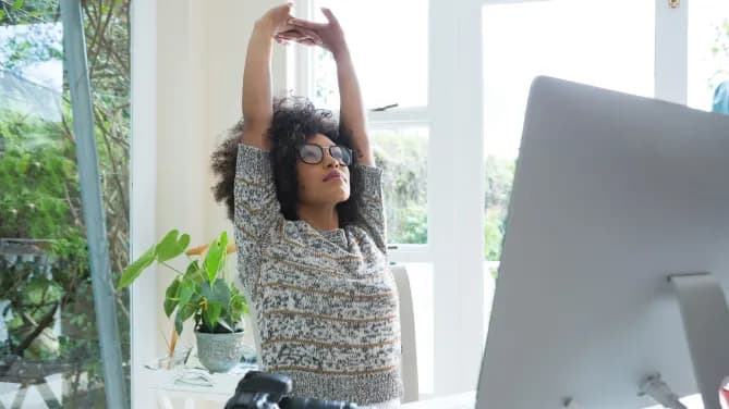 woman doing stretch at desk