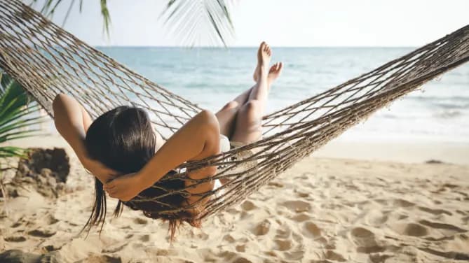 woman in a beach hammock
