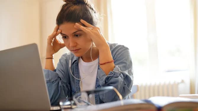 woman sitting on laptop job-searching