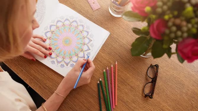 Woman Using Adult Coloring Book