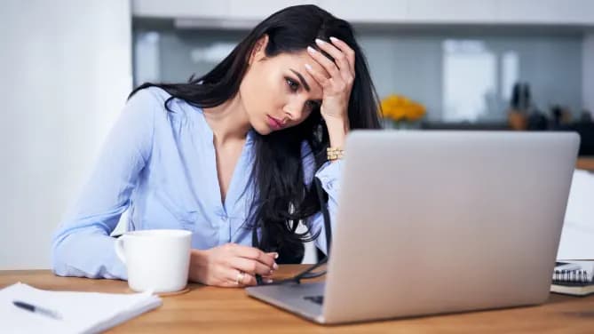 Woman frustrated at computer