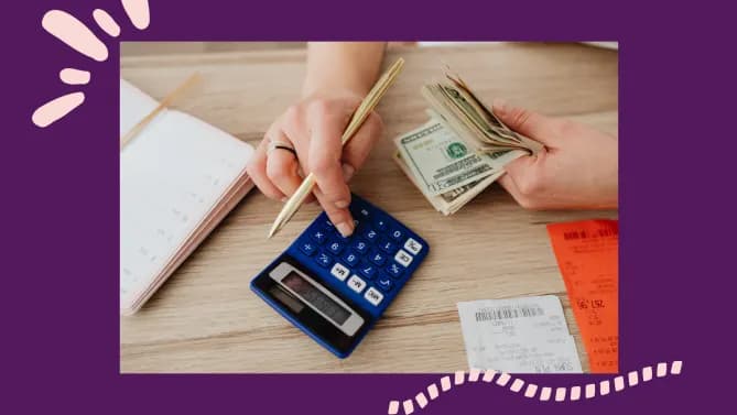 woman using calculator holding bills