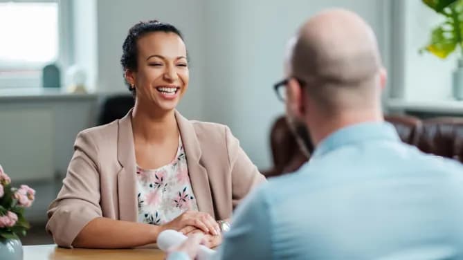 woman laughing in job interview