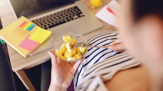Pregnant woman being healthy at work