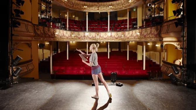 actress rehearsing in a theater