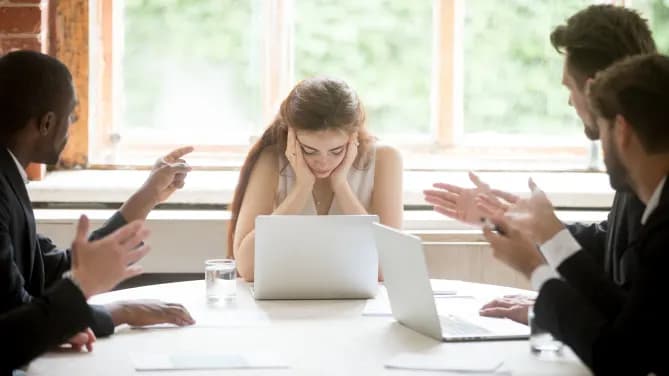 woman being bullied in a meeting
