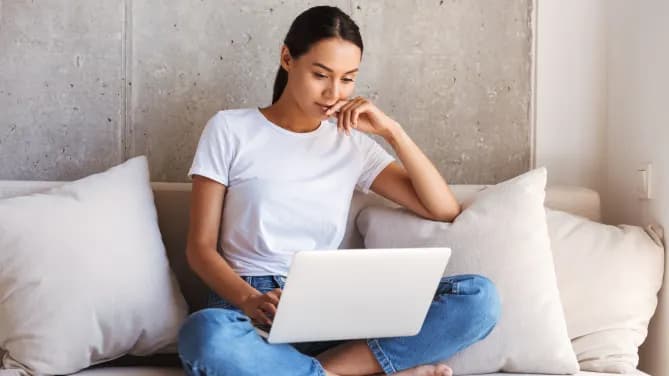 woman reading blog on laptop