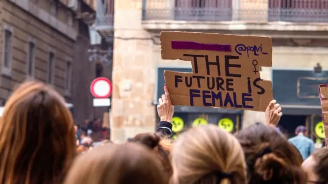 feminist protest with "The future is female" sign