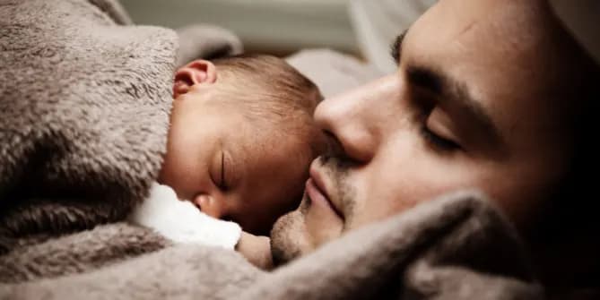 sleeping father and baby