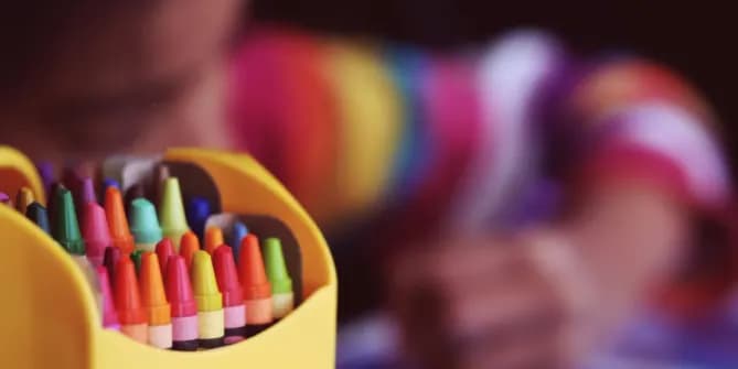 Crayons with child coloring