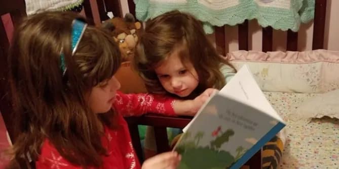 Two children reading a story