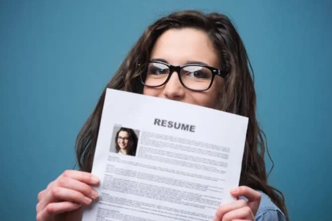Woman holding resume